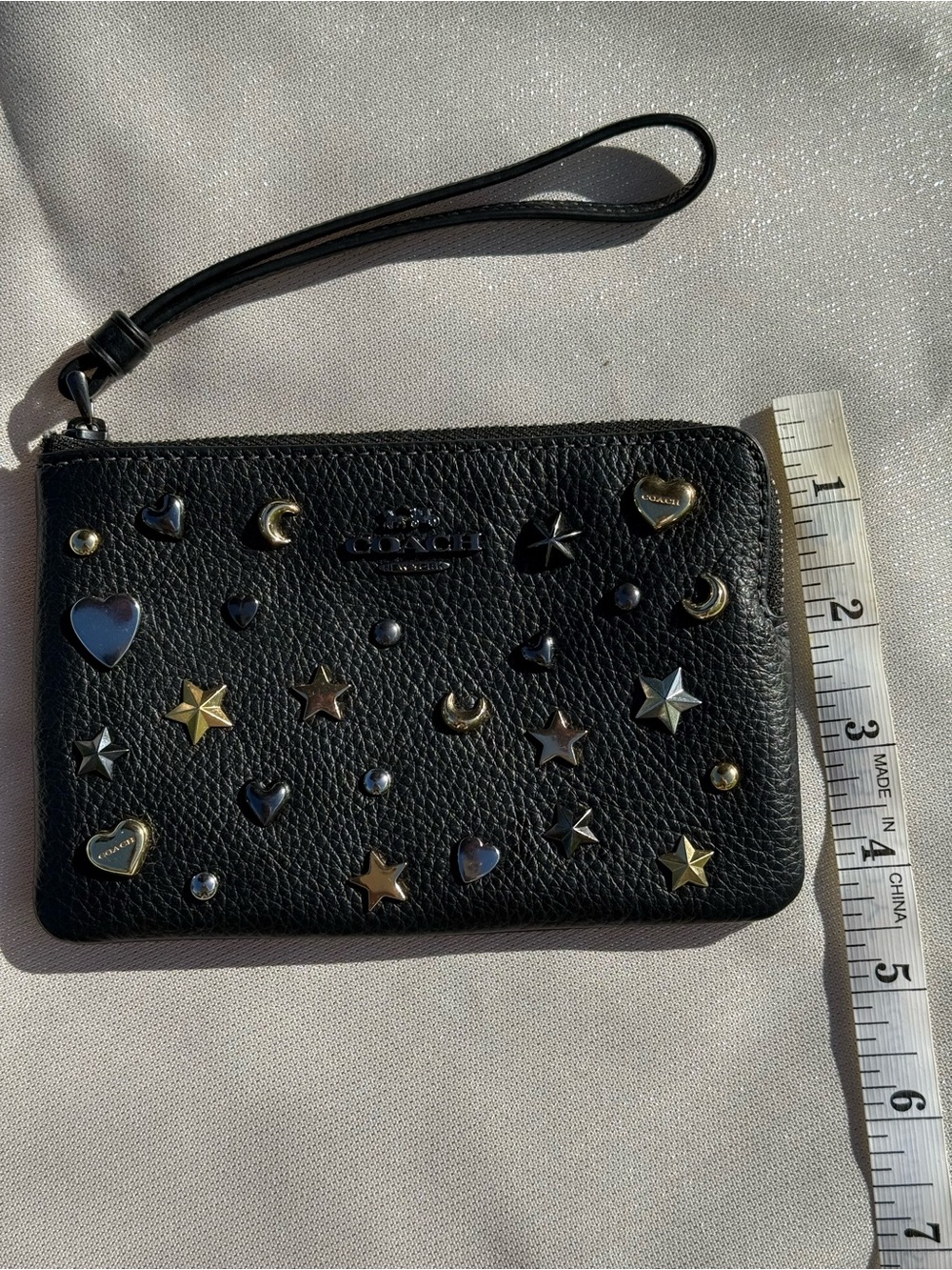 Coach Black Pebbled Leather Star & Heart Stud Wristlet with Metallic Accents - Picture 2 of 5